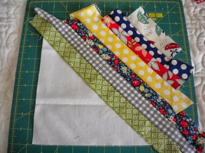 String Quilt Block Tutorial featured by top US quilting blog, A Quilting Life: image of string quilt block step five