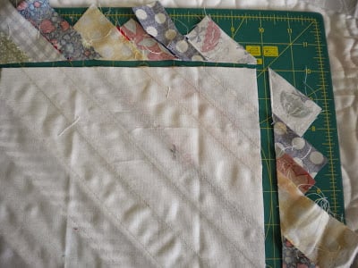 String Quilt Block Tutorial featured by top US quilting blog, A Quilting Life: image of string quilt block trimming