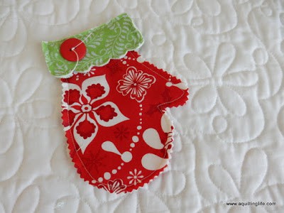 15 Things to Make for Christmas featured by Top US Quilting Blog, A Quilting Life: image of mitten ornament