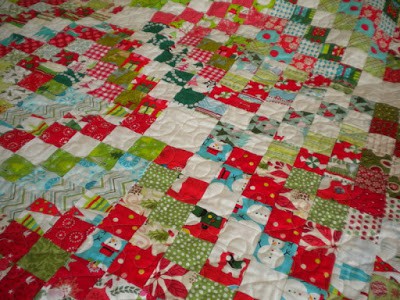 15 Things to Make for Christmas featured by Top US Quilting Blog A Quilting Life: image of scrappy trip quilt in Christmas fabrics